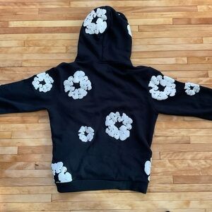 Denim Tears Black Hoodie with White Floral Design